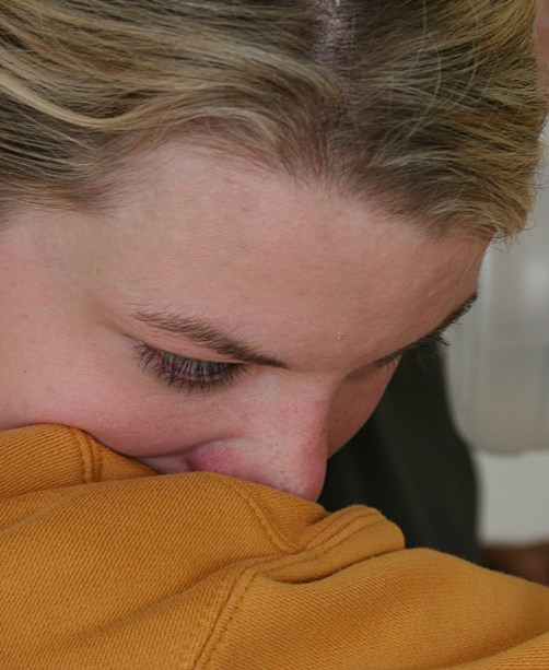 Adrienne buried her nose in her sleeve and stepped out of the garage a few times when she couldn't handle the overwhelming sting of the horseradish.