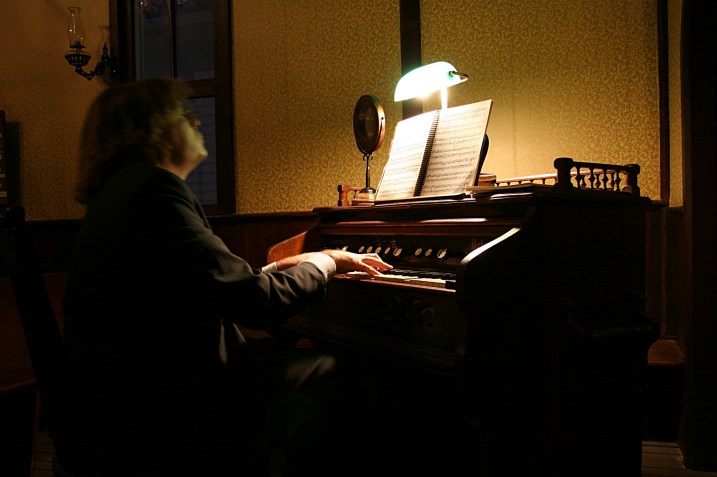 Playing the old pump organ.