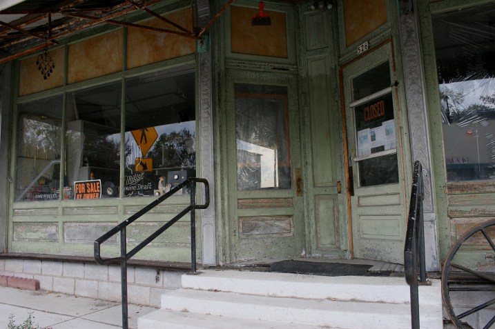 The building to the north of the garage (and deer head) that's for sale.