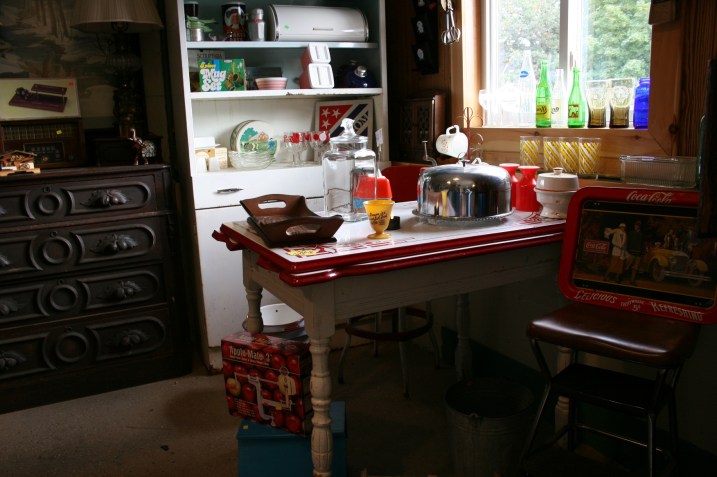 In the white cupboard behind the table sits the small striped Pyrex bowl I purchased.