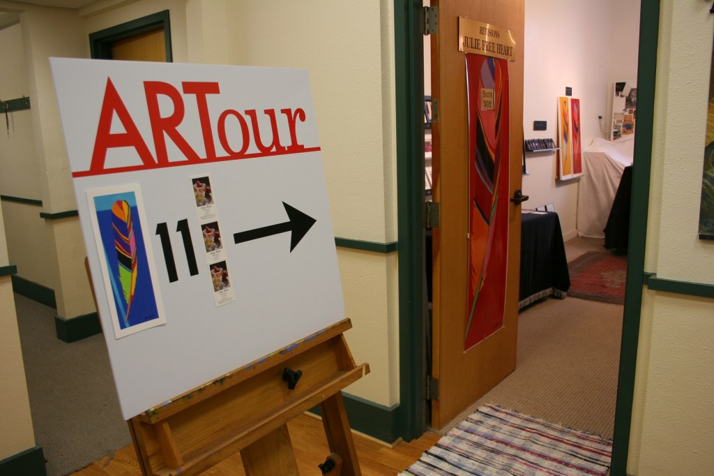 A sign directs visitors to Julie Free Heart's Revisions studio.
