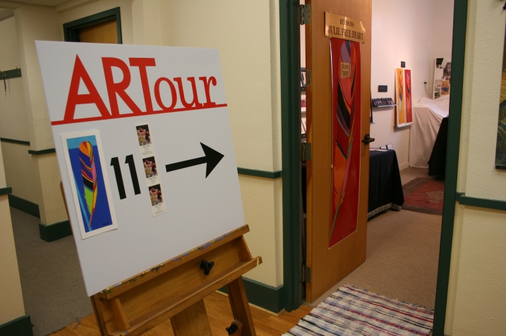 A sign directs visitors to Julie Free Heart's Revisions studio.