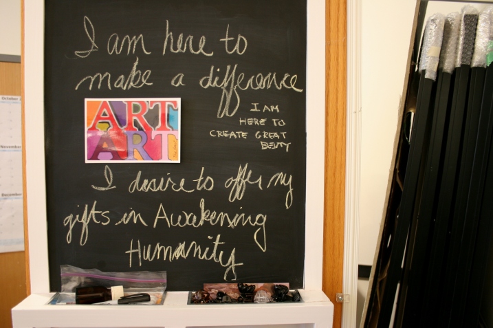A message chalked on the back of Free Heart's studio door shares her philosophy on art.