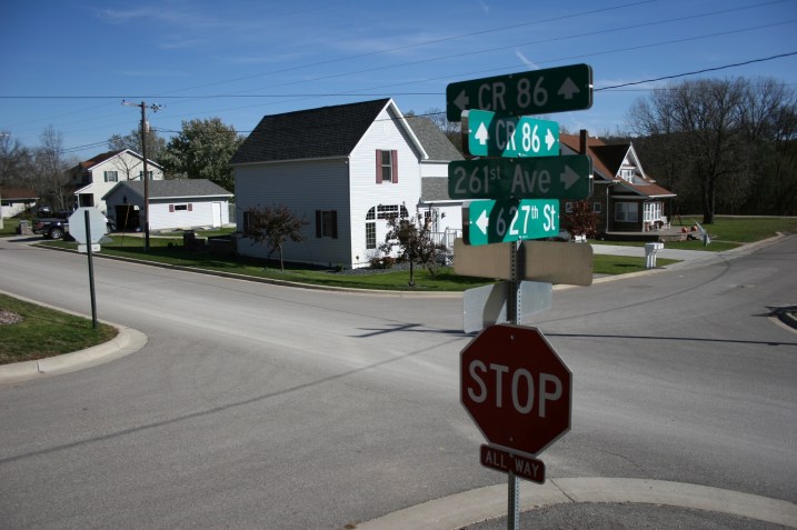 Well kept homes and a small playground/park border one side of the main drag, where I spotted this mass of signage on the corner by St. Joseph's Catholic  Church.