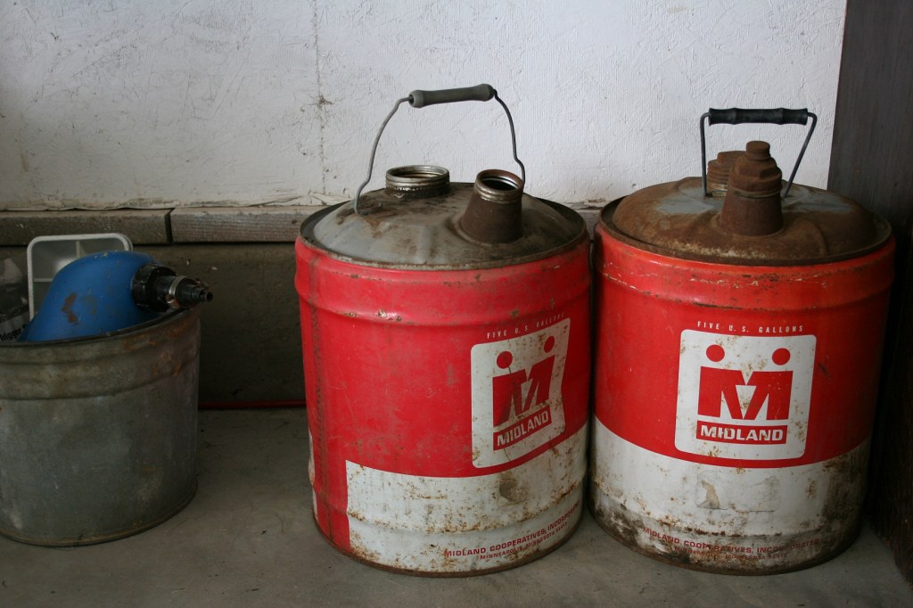 Vintage gas cans in my brother's garage.