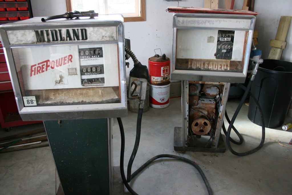The vintage Midland gas pumps purchased by my Uncle Milan at the gas station auction. My brother Brian recently bought the pumps from Milan with plans to restore them.
