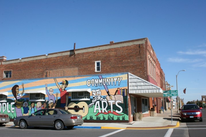 Across the street from the arts center.