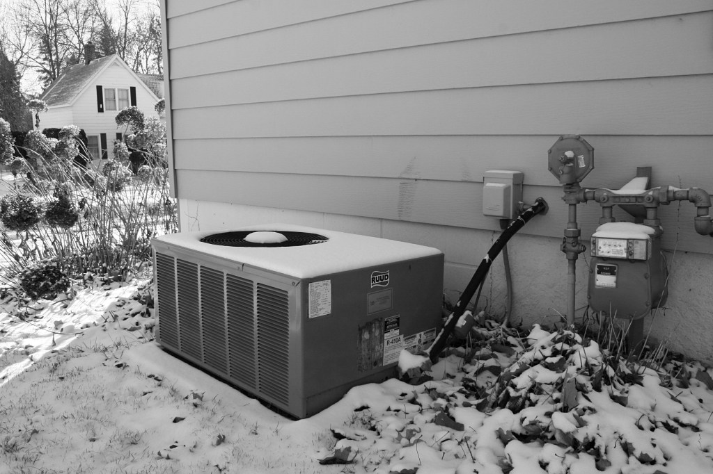 Look just to the left of the meters and above the air conditioned and you will see marks from where a tire hit our house.
