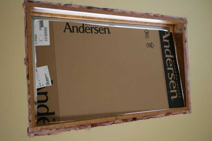 New window installation in progress and the cardboard curtain. Minnesota Prairie Roots file photo 2011.