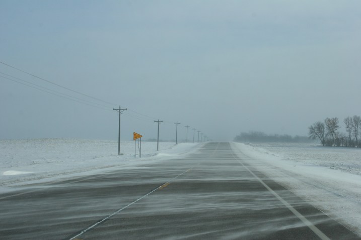 Strong winds drift snow across U.S. Highway 14 east of Lamberton this morning.