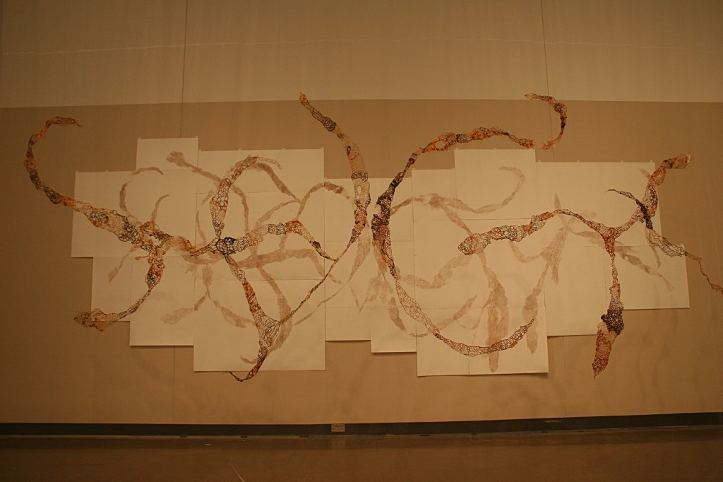 A wall-size artistic interpretation of Opuntia by Laura Cooper.