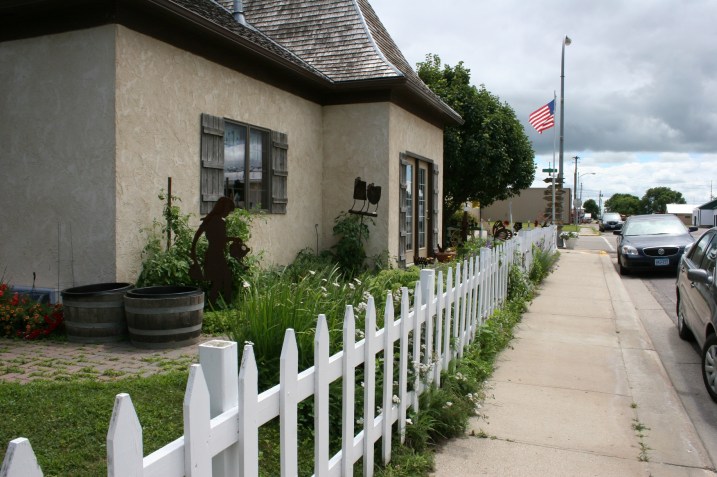 A final parting shot showcases the white picket fence surround this former gas station now turned European style eatery.