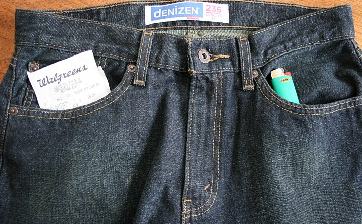 Jeans purchased at Target with a receipt in one pocket and a Bic lighter in the other.