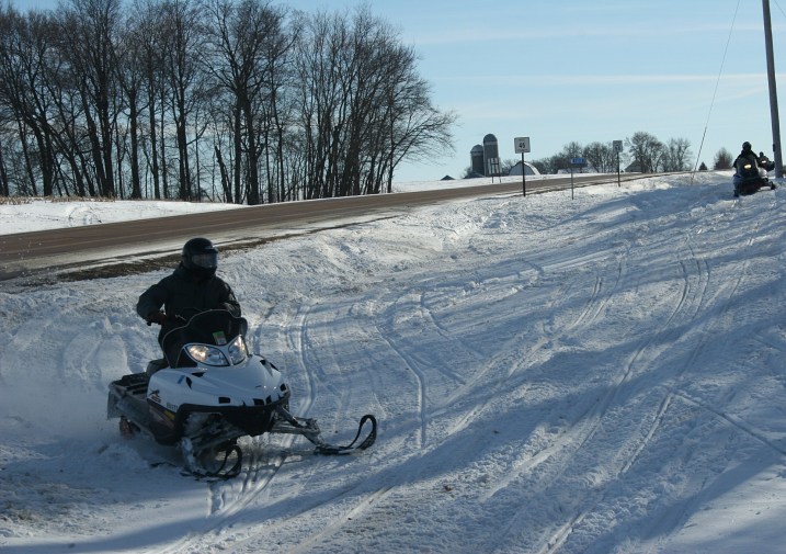 These Minnesotans preferred driving their snowmobiles in the ditch along a Rice County Road.
