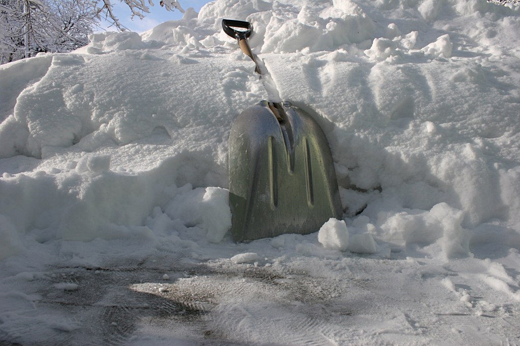 A scoop shovel worked best for removing this snow. I shovel where the snowblower can't go.
