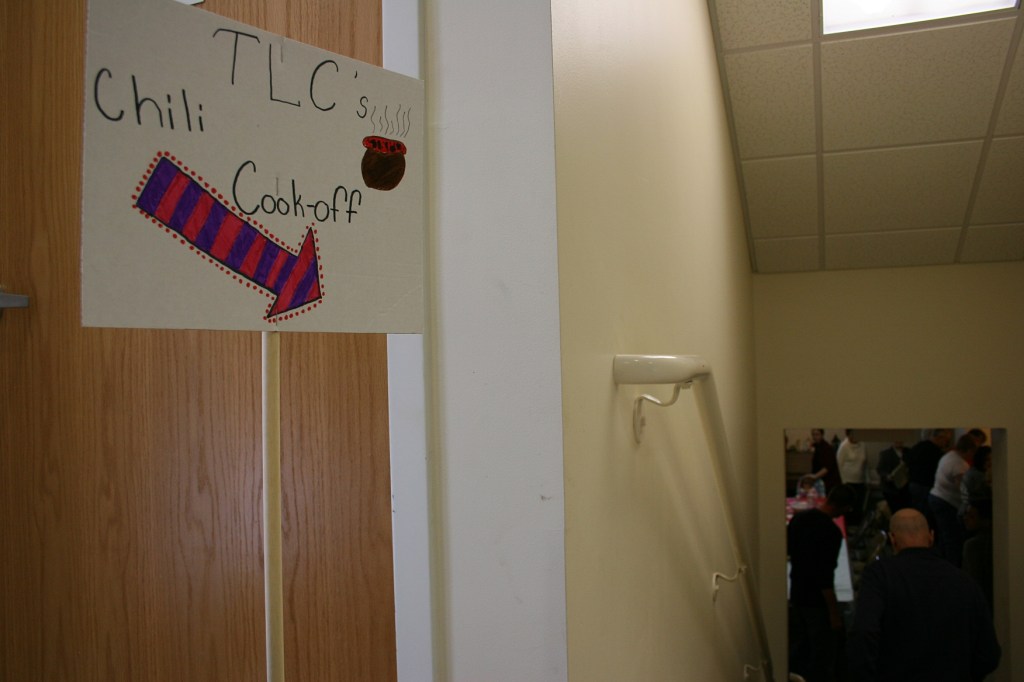 A sign directs diners to the church basement.