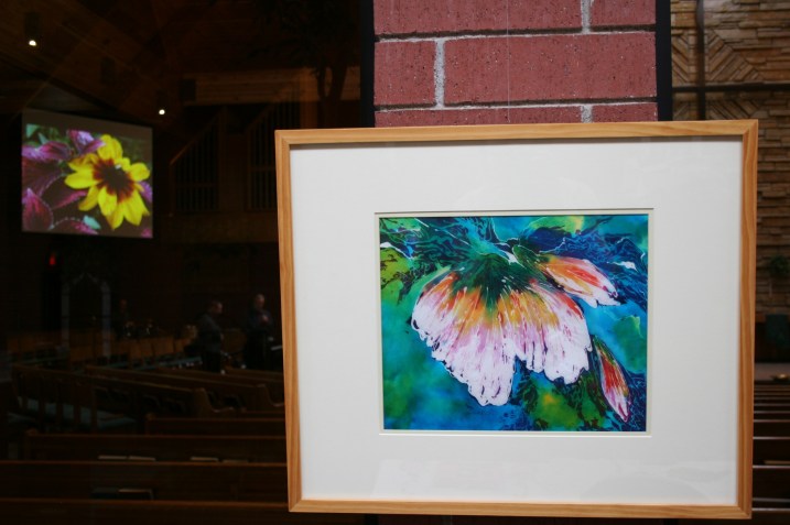 A floral batik by Arlene Rolf graces a wall in the narthex. Inside the sanctuary, my flower photos are showcased on the screens.
