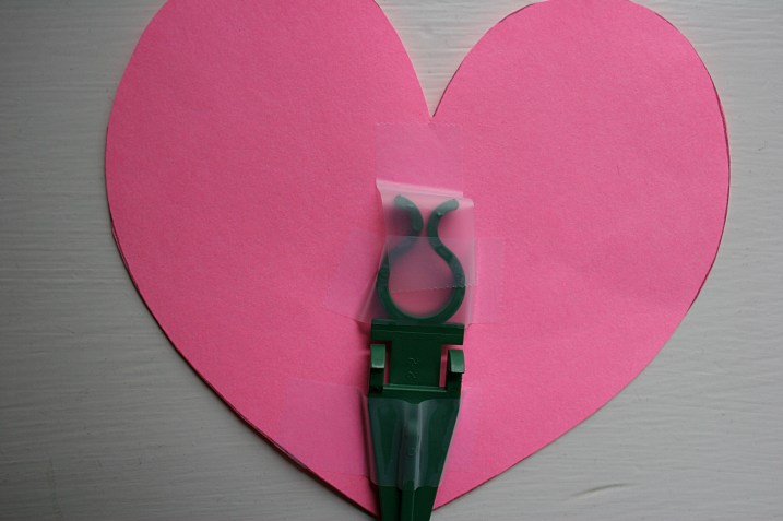 Each paper heart was secured to a plastic stake with regular tape.