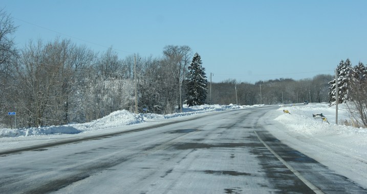 Minnesota Highway 60 just outside of Faribault Saturday morning shows a mostly snow-packed highway with a few patches of pavement showing.