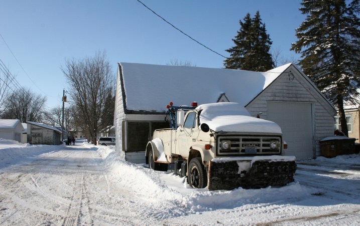 A Montgomery Oil Co. tow truck photographed recently along a residential street in Montgomery, Minnesota. Is this parked at the site of the former service station?