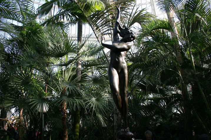 Admire the art, including this statue in a Palm Dome fountain.