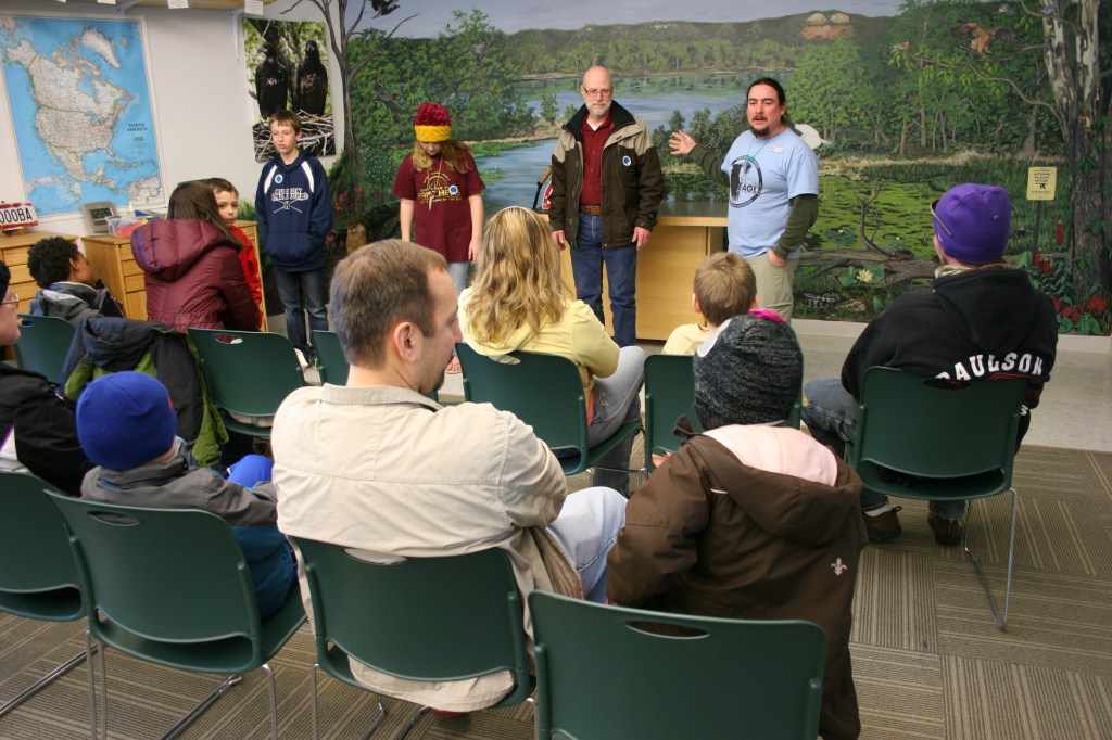 My husband, second from right, plays a bald eagle.