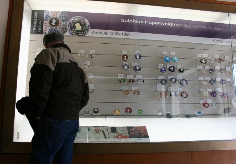 My husband, Randy, checking out a section of paperweights.