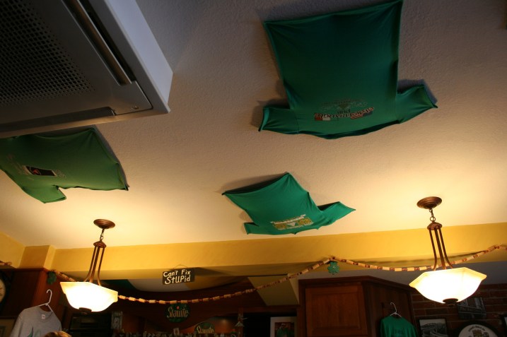 T-shirts on the pub ceiling.