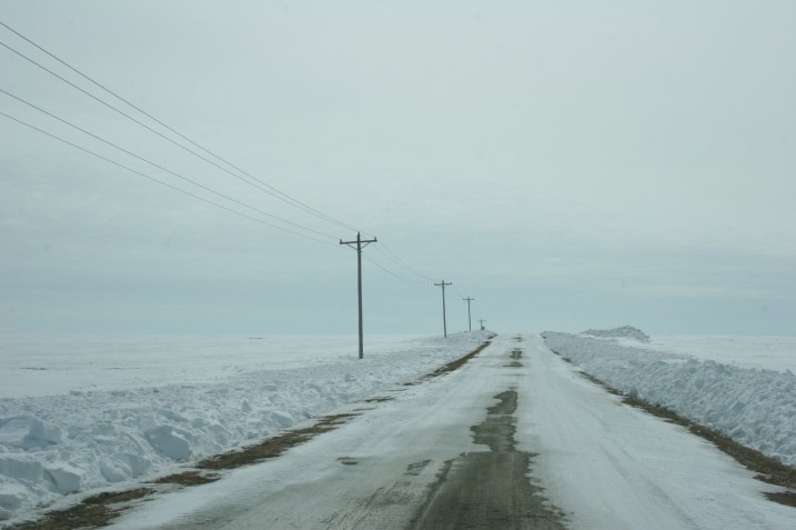 The half muddy, half icy road.