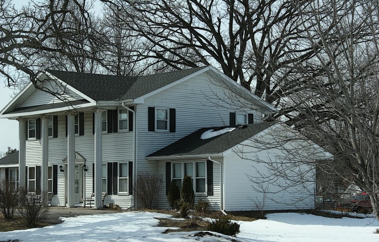 This colonial style home atop a hill along Wisconsin Highway 21 in Arkdale always catches my eye.