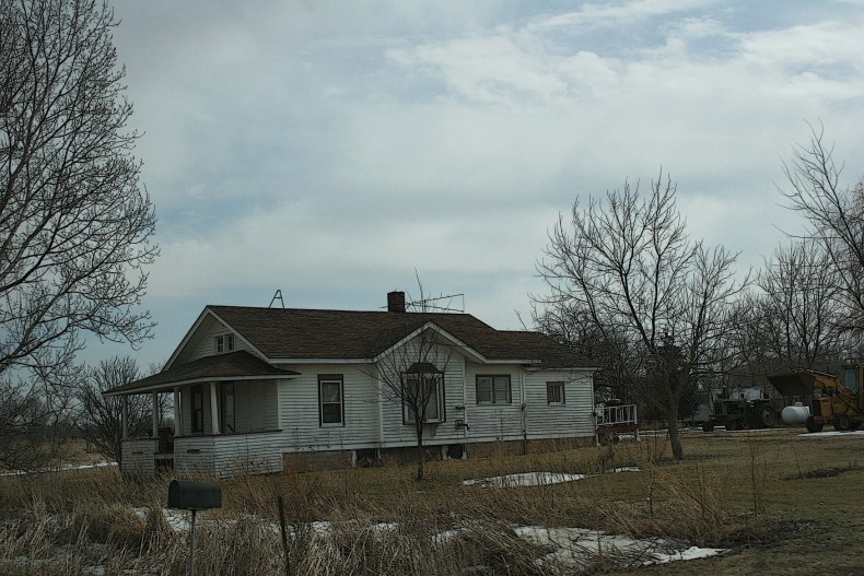 There is something sweet and endearing about the simplicity of this country home near Redgranite, Wisconsin. Perhaps it's the porch, the setting...the welcoming style.