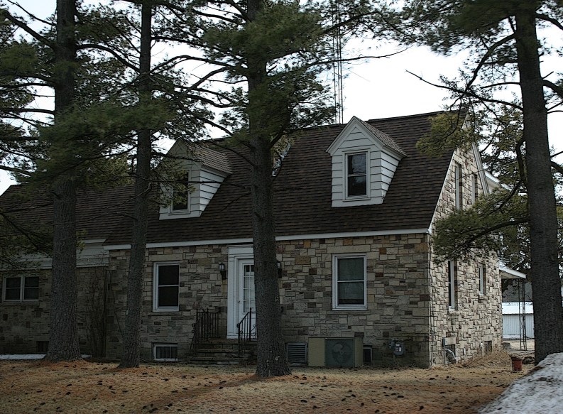 A stunning Cape Cod style home constructed from locally quarried stone near Redgranite, Wisconsin.