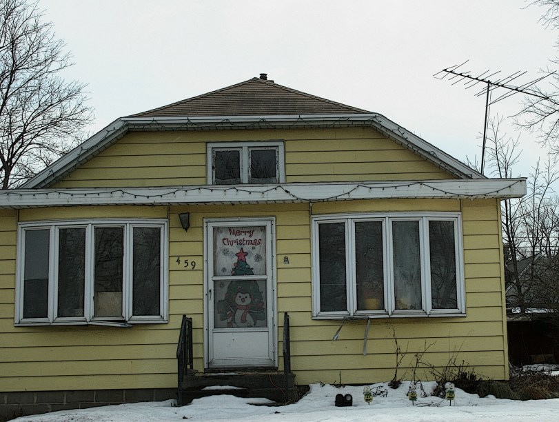 This cheery yellow house is located along Wisconsin Highway 21 in Redgranite. A welcoming holiday banner still graces the front door three months after Christmas.