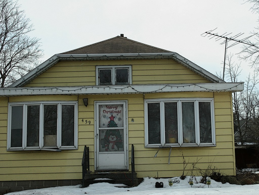 This cheery yellow house is located along Wisconsin Highway 21 in Redgranite. A welcoming holiday banner still graces the front door three months after Christmas.