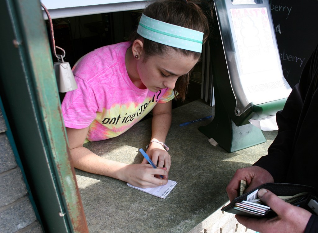 Taking an order at the outdoor service window.