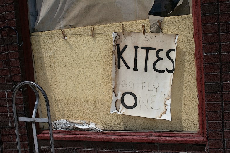 Sign in the window of Horsfall's Lansing (Iowa) Vareity. Photographed in July 2013.