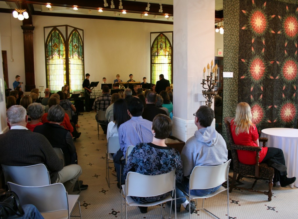 During the open reception, musicians performed in the venue space, where several quilts are displayed.