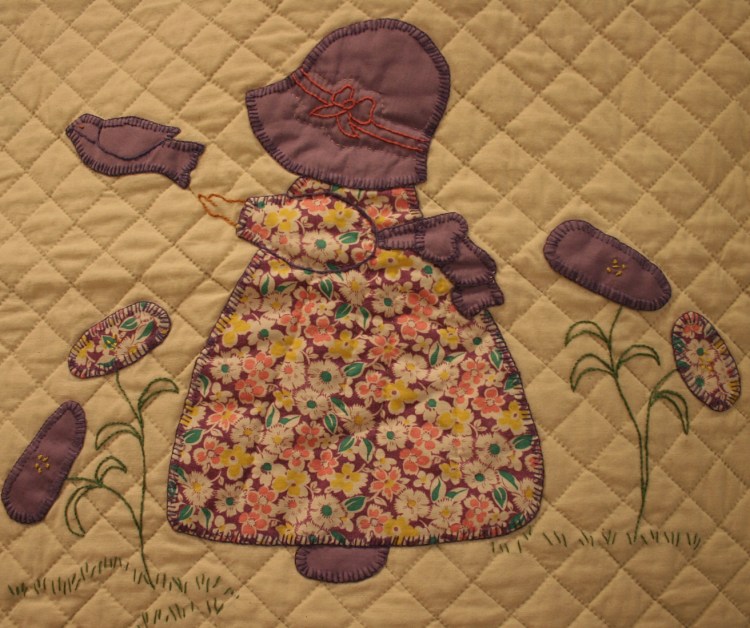 This block from the 1930s Sunbonnet Sue pattern features quilting and embroidery.