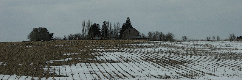 Rural Minnesota, farm behind hill