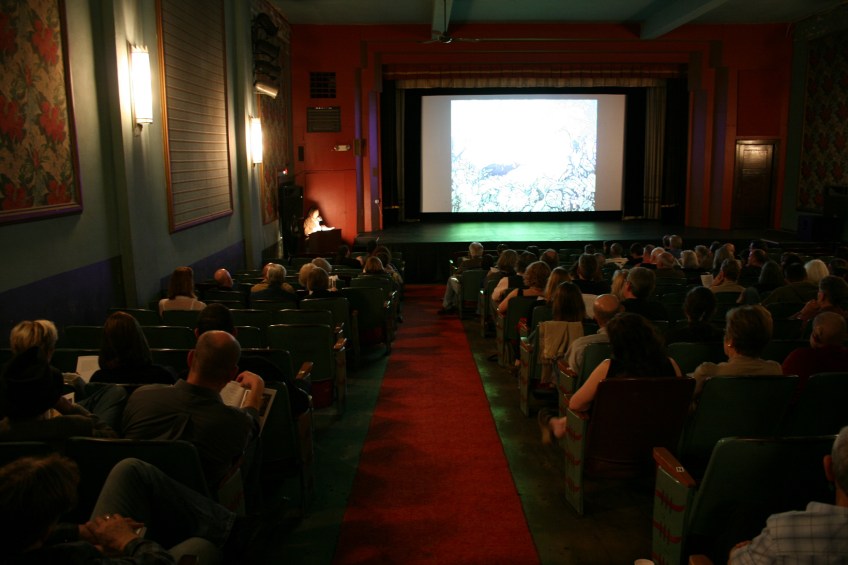 Inside the historic State Theatre, artists and poet presented to a nearly full house.