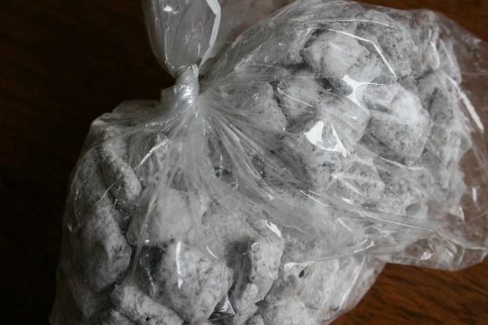 Yummy puppy chow bagged and placed inside a decorated brown paper bag.