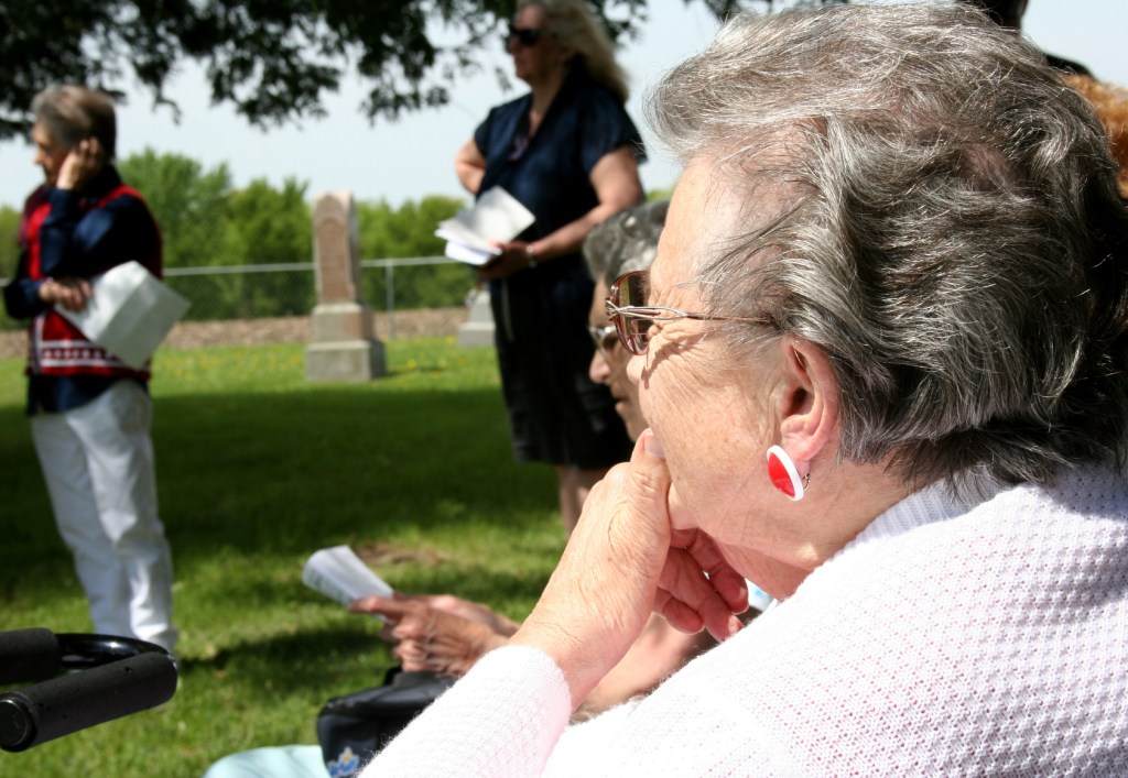Jean Pederson listens after reciting "In Flanders Fields."