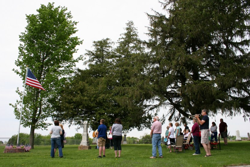 The program opens with singing of "The Star Spangled Banner." Steve Bonde is on the bugle.