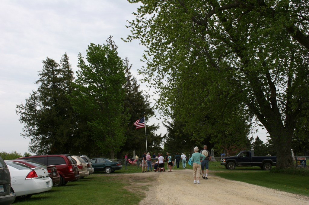 Folks begin arriving for the 2 p.m. Memorial Day program at the Cannon City Cemetery.