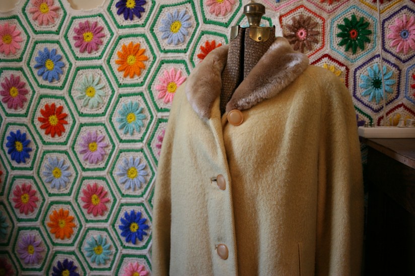 It takes an artist's eye to pair this coat with this afghan.