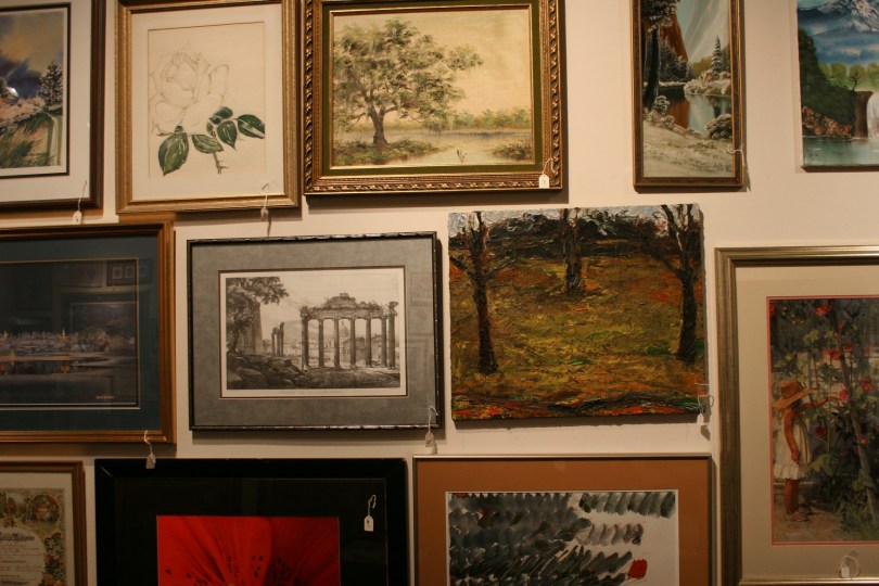 Originals and prints fill the gallery walls.