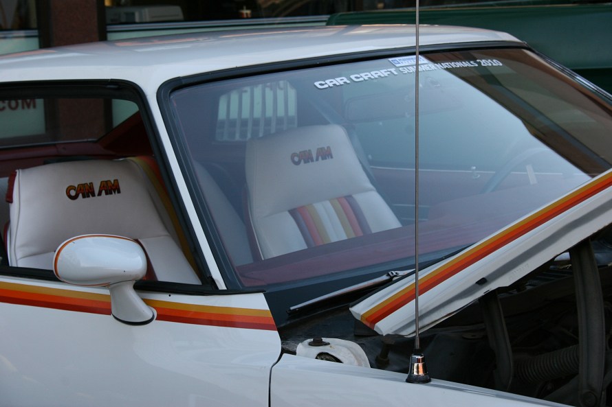 Custom upholstery matches the exterior paint striping.