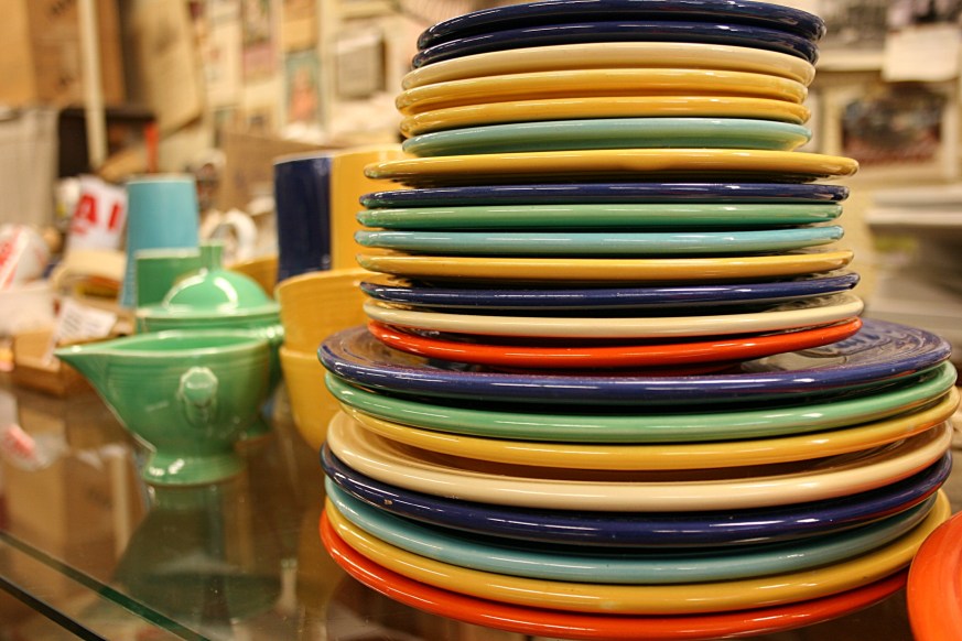 A stack of colorful Fiesta ware awaits a buyer.