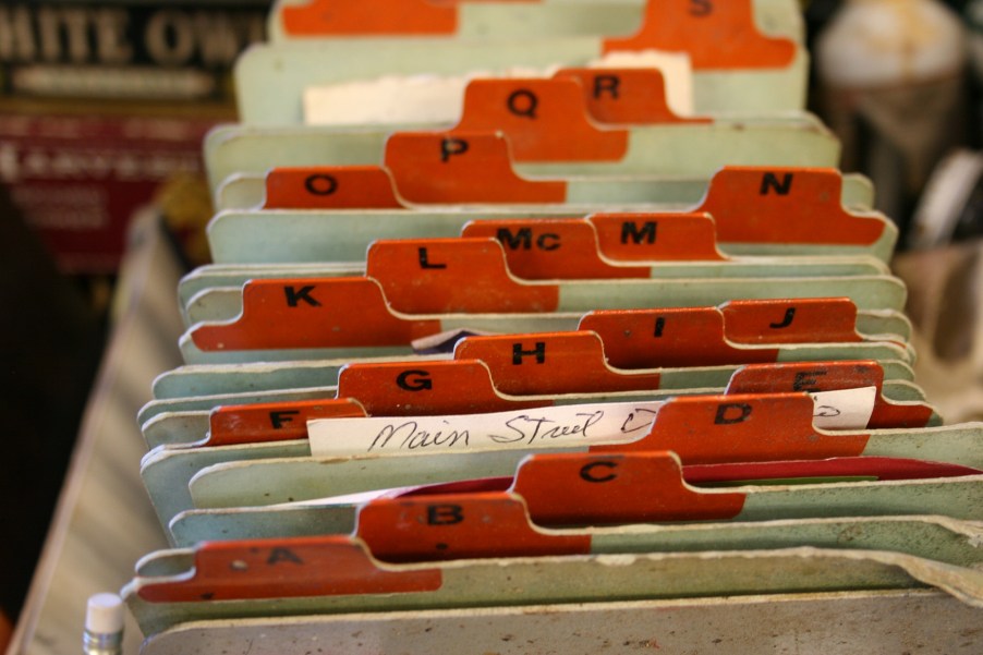 These, Wayne tells me, are his "computer files," handwritten cards detailing customers' paint purchases.