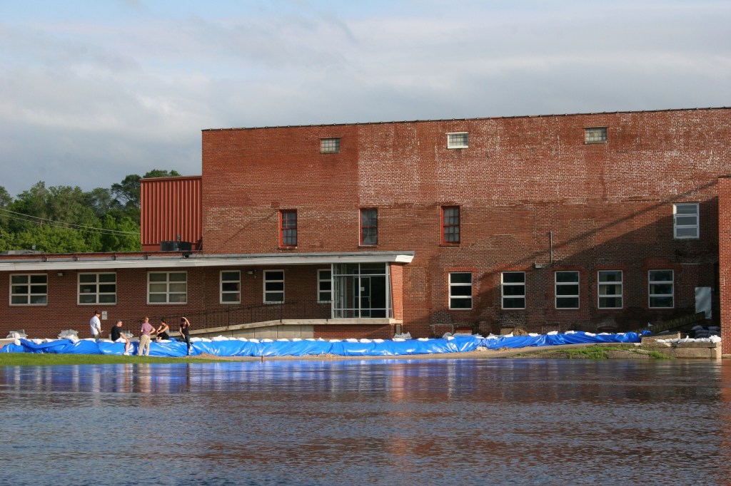 Sandbags have been placed in the mill parking lot next to the Cannon River.